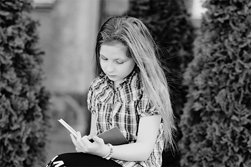 Young girl reading a book